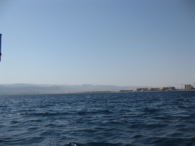  > To the left is Eilat, Israel. To the right is Aqaba. To the far left is Tabah, Egypt. To the right about 20km down is Saudi Arabia.